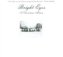 Album cover for A Christmas Album by Jake Bellows / Bright Eyes / Gretta Cohn / Armand Costanzo / Denver Dalley / Stefanie Drootin / Orenda Fink / Neely Jenkins / Jiha Lee / Andy LeMaster / Mike Mogis / Conor Oberst / Matt Oberst / Stephen Pedersen / Blake Sennett / Macey Taylor / Maria Taylor / Nick White